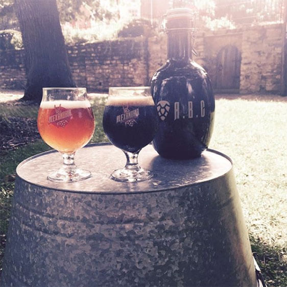 Alexandria Brewing Company on the News Alexandria Brewing Company's logo is showcased on glasses and a growler for a local news spot